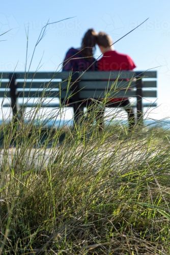 blurred-couple-from-behind-sitting-on-park-bench-austockphoto-0000472192.jpg