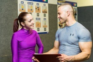 young-woman-and-man-talking-in-fitness-club.jpg