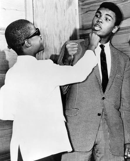 13_year_old_stevie_wonder_goofing_around_with_muhammad_ali_at_the_apollo_harlem_1963.jpg