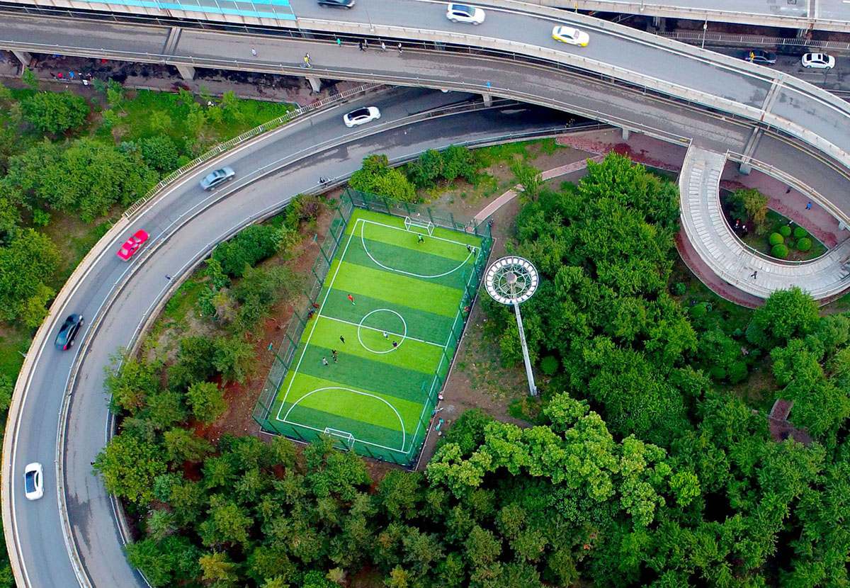 an_aerial_view_of_a_football_pitch_located_near_an_interchange_in_shenyang_in_china_s_northeastern_liaoning_province.jpg