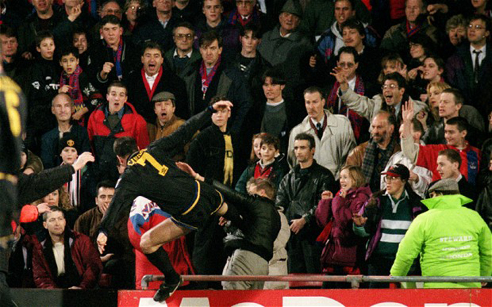 manchester_united_s_eric_cantona_stunned_the_football_world_with_his_infamous_kung-fu_kick_at_a_fan_who_he_claimed_had_baited_him.jpg