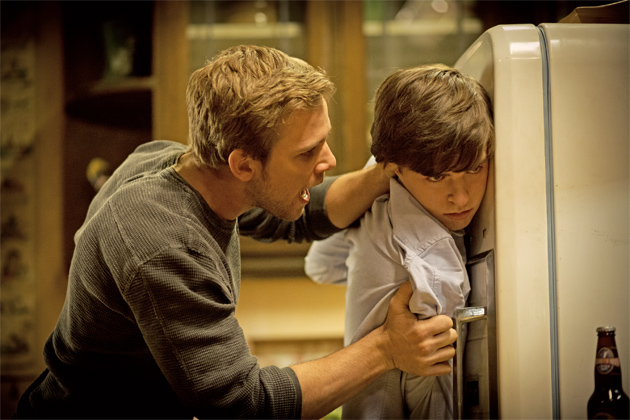 19-dylan-holds-norman-up-against-the-fridge.jpg