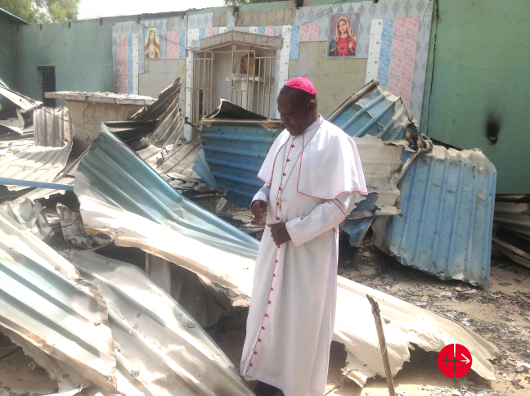 dscnigeria_bishop-oliver-dashe-doeme-in-the-remains-of-a-catholic-church-in-bahuli_530.jpg