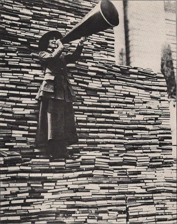 A woman calls for more books to be donated to the New York Public Library on Fifth Avenue, early 1910s..jpg