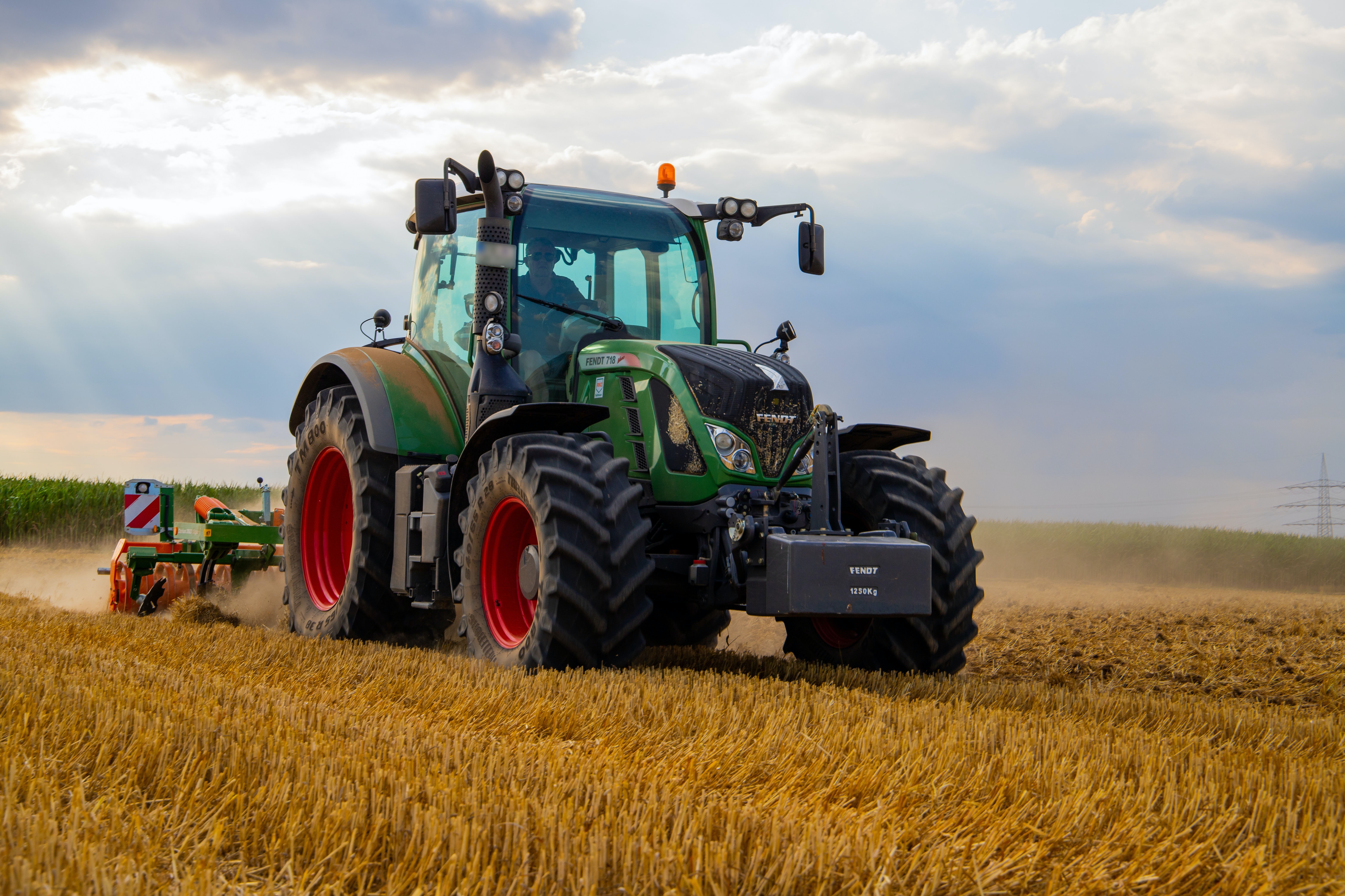 green-tractor-plowing-the-fields-on-focus-photography-2933243.jpg