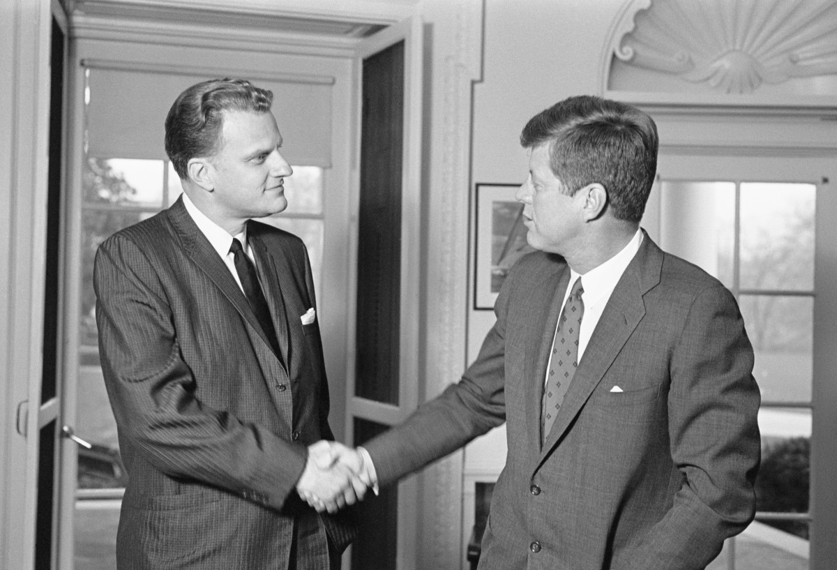 evangelist-billy-graham-chats-with-president-john-kennedy-during-an-unannounced-visit-to-the-white-house-today-getty.jpg