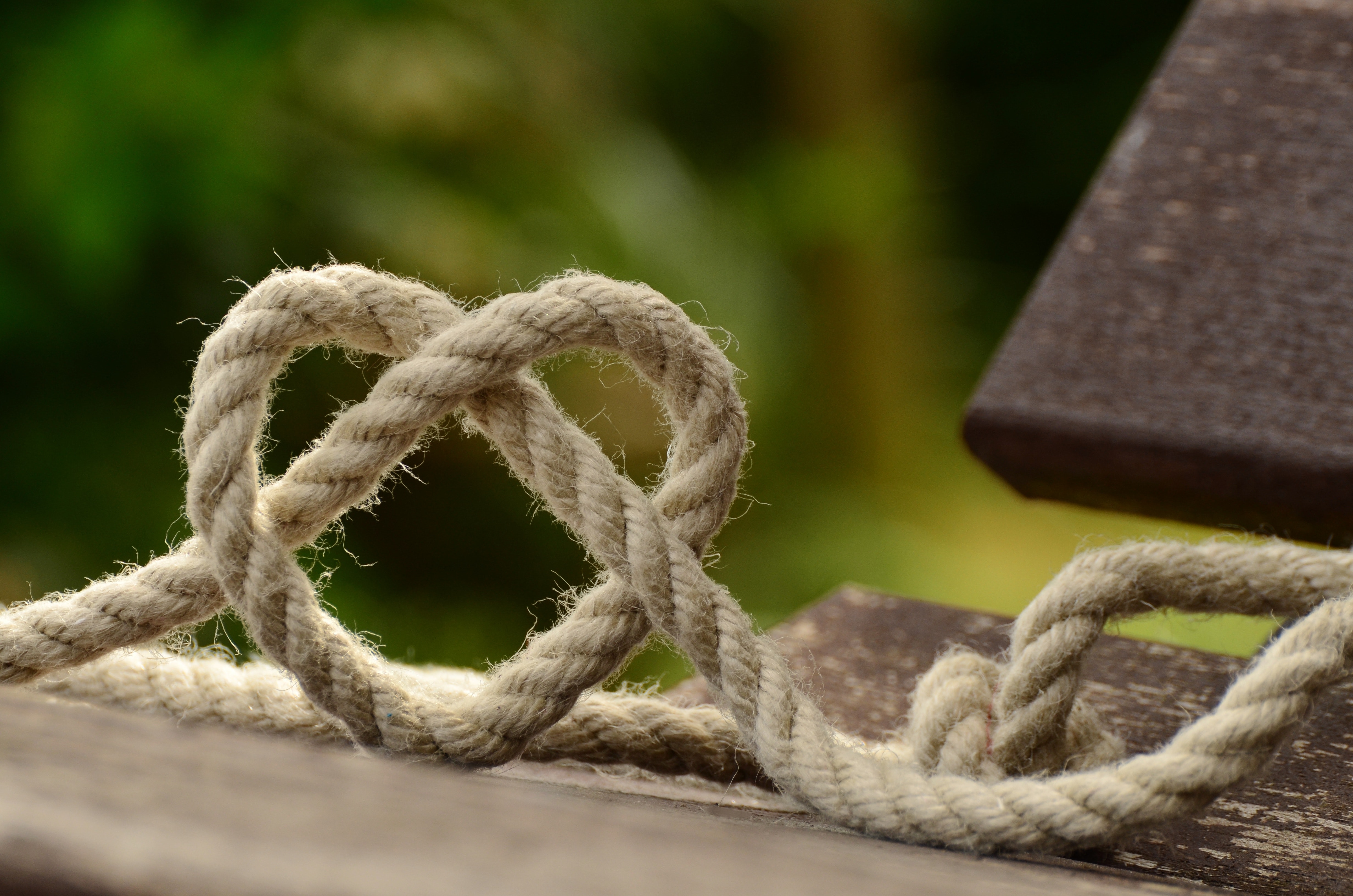 brown-rope-tangled-and-formed-into-heart-shape-on-brown-113737.jpg