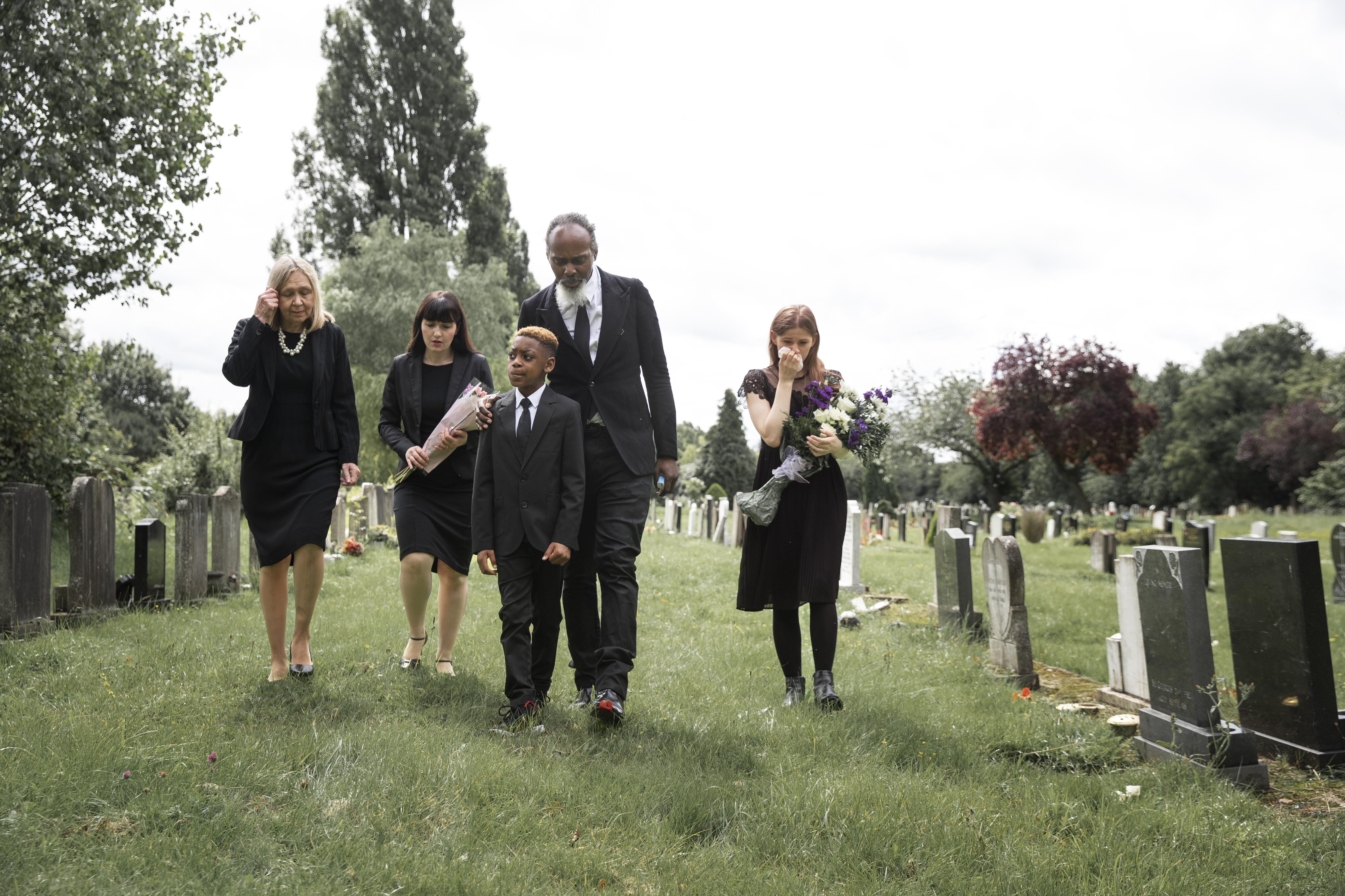 family-visiting-grave-loved-one.jpg