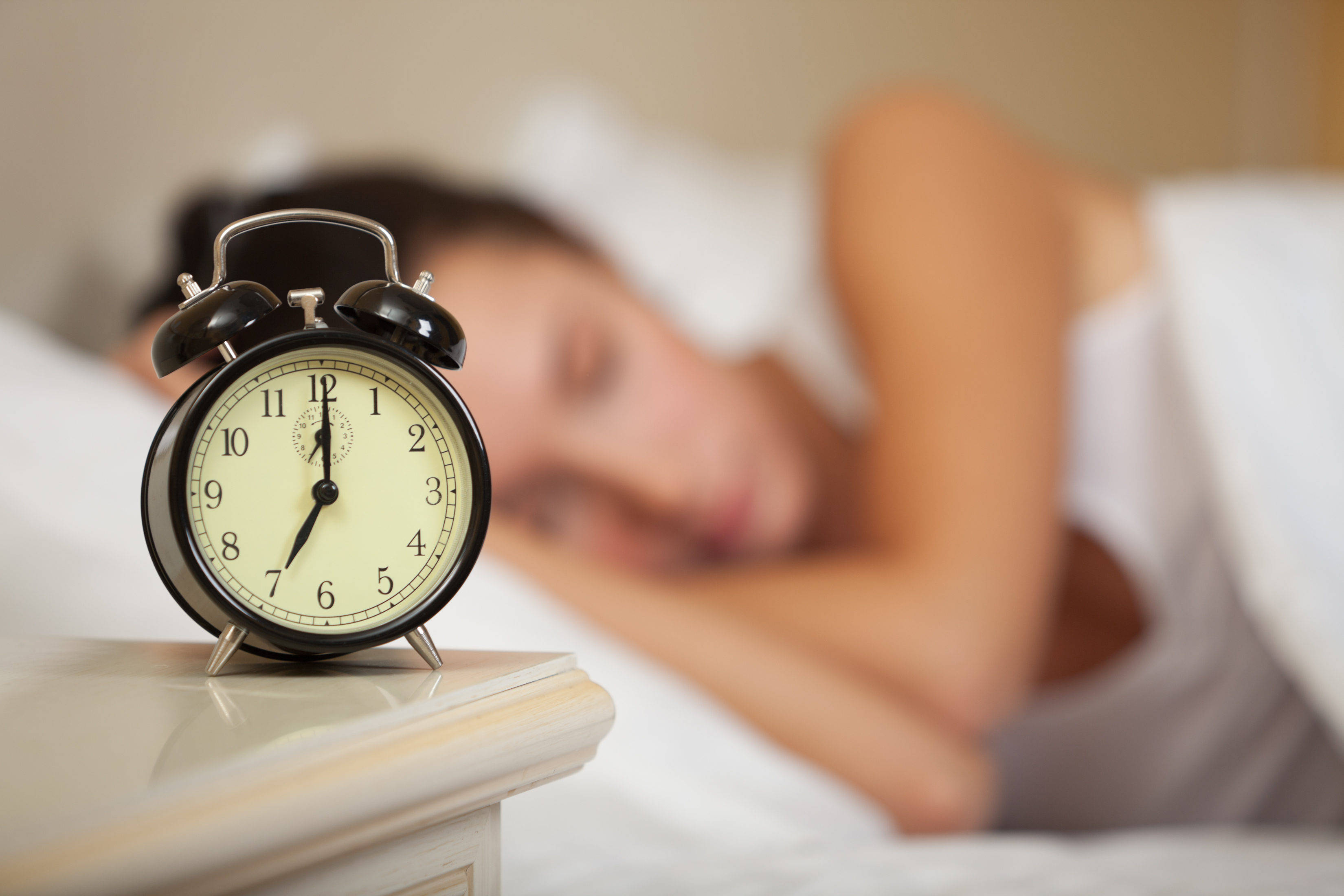 sleeping-woman-and-alarm-clock-bedroom-home.jpg