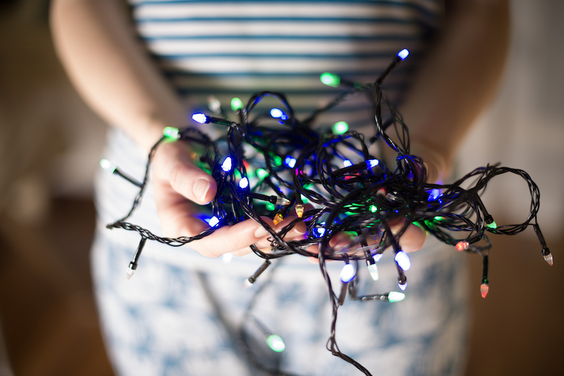 woman-holding-christmas-lights.jpg