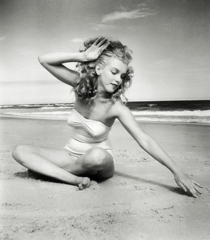 young_marilyn_monroe_white_one-piece_bathing_suit_drawing_in_sand.jpg