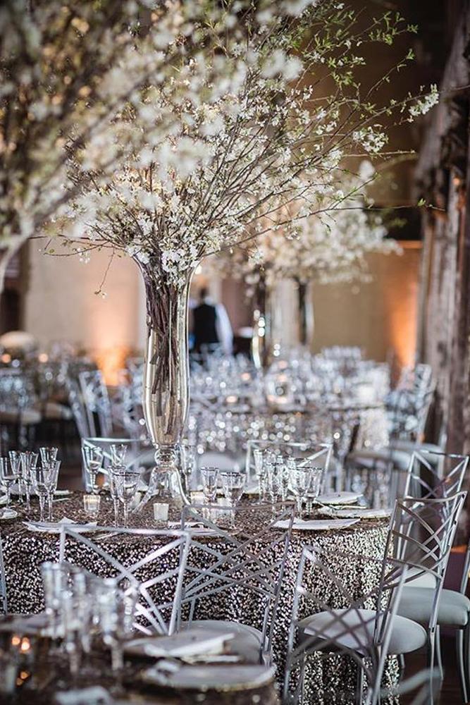 silver-wedding-decor-ideas-tall-tree-centerpiece-with-white-flowers-on-silver-table-brian-adams-photo.jpg
