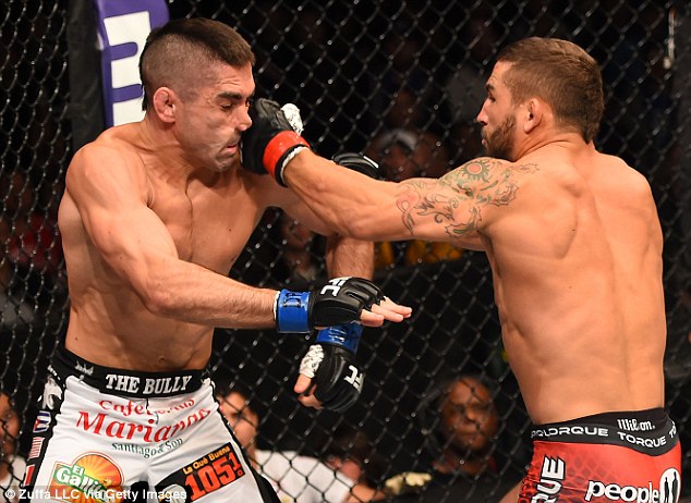 274a4b4000000578-3025976-chad_mendes_punches_ricardo_lamas_in_their_featherweight_fight_d-m-46_1428188134141.jpg