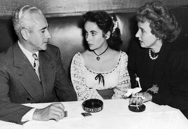 elizabeth_taylor_with_parents_at_stork_club_1947_pd.jpg