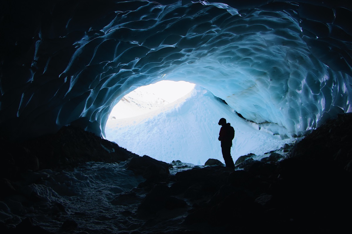 silhouette-photo-of-person-standing-in-cave-3098796.jpg
