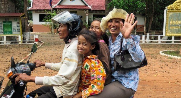 cambodia-asia-siem-reap-motorcycle-family-wave.jpg