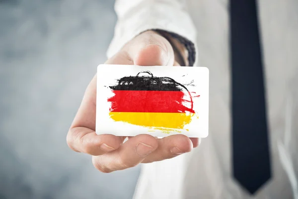 depositphotos_40872327-stock-photo-german-businessman-holding-business-card.jpg