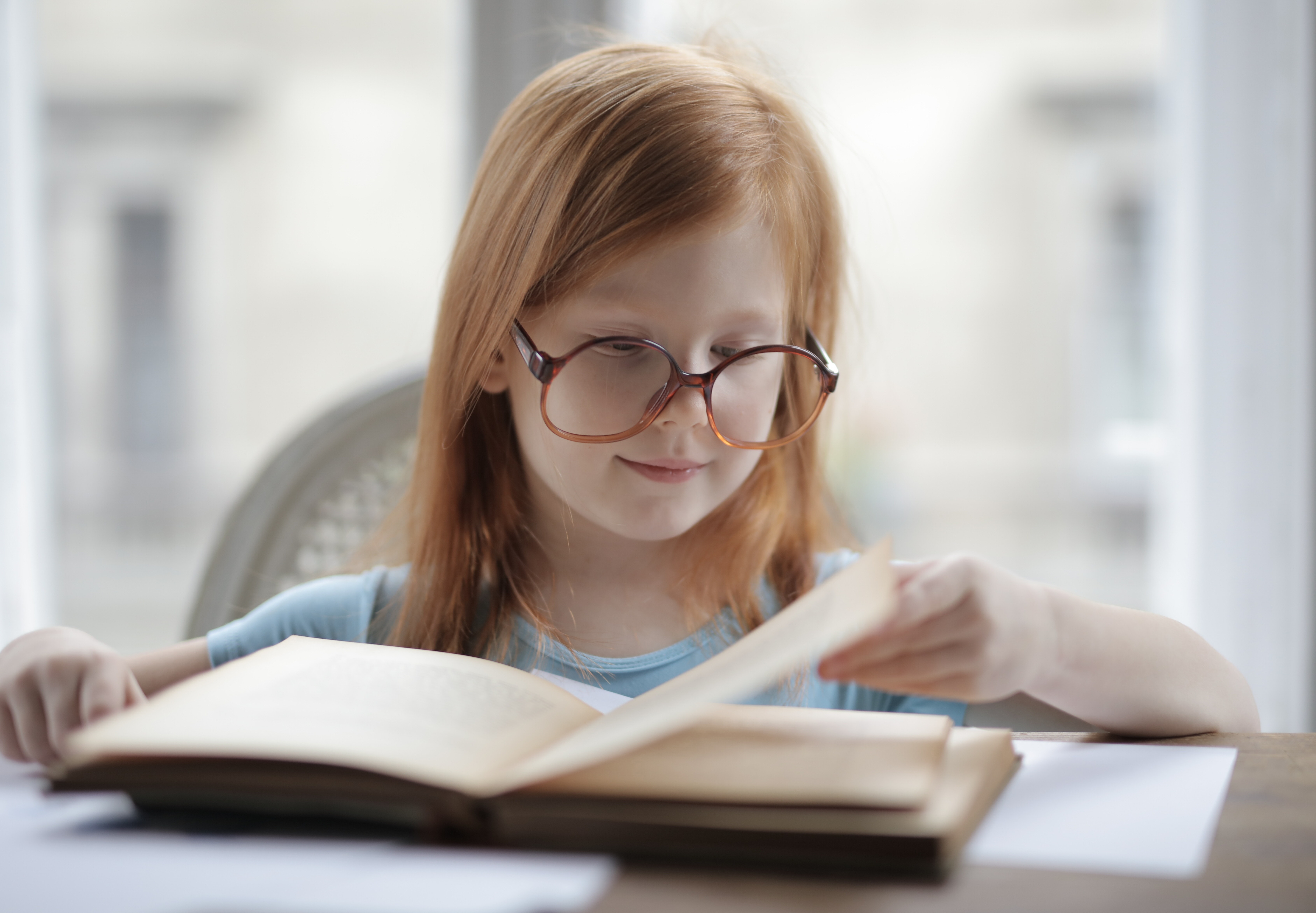 girl-reading-a-book-with-eyeglasses-3887454.jpg