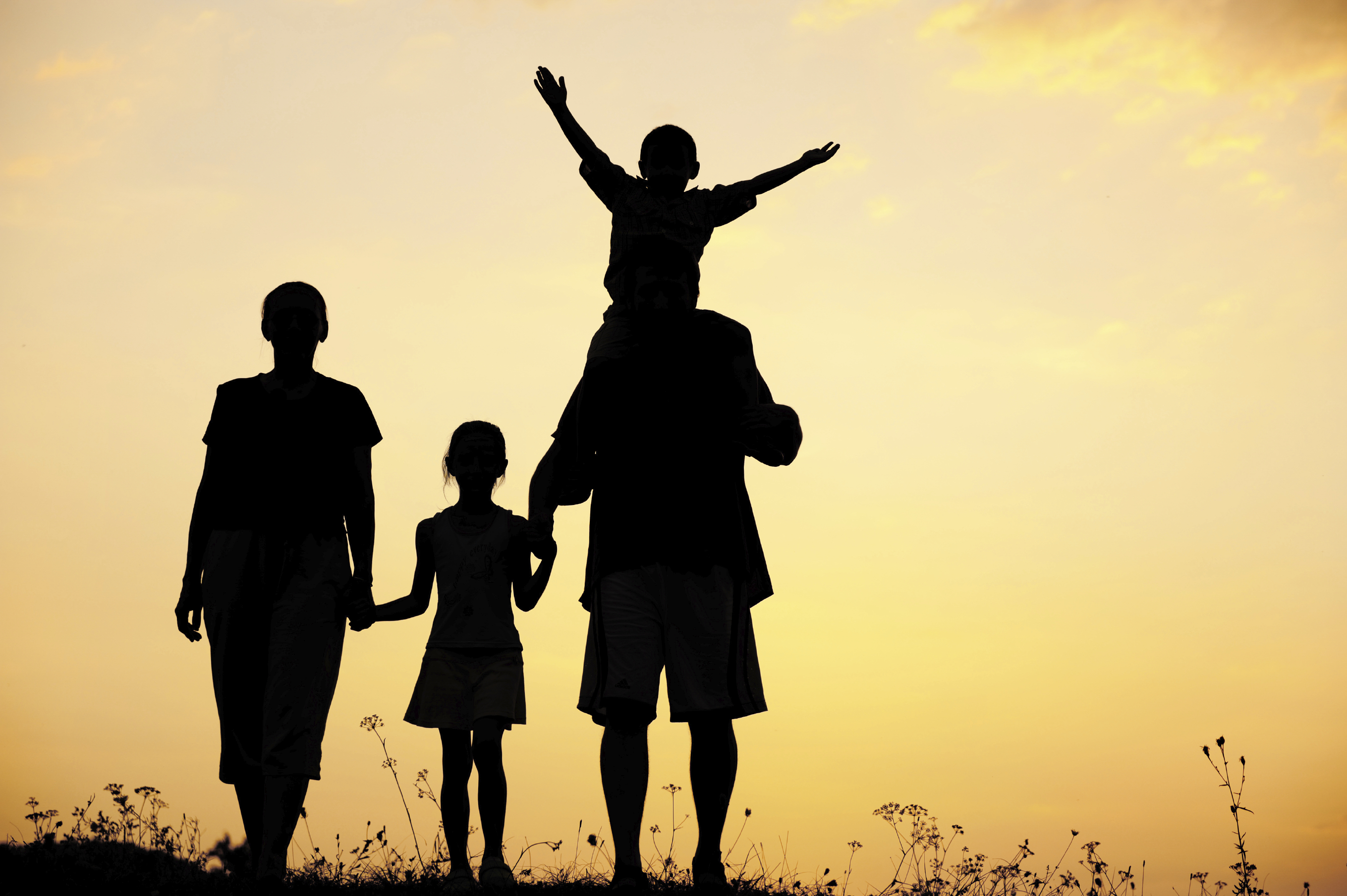 family-with-sunset-background.jpg