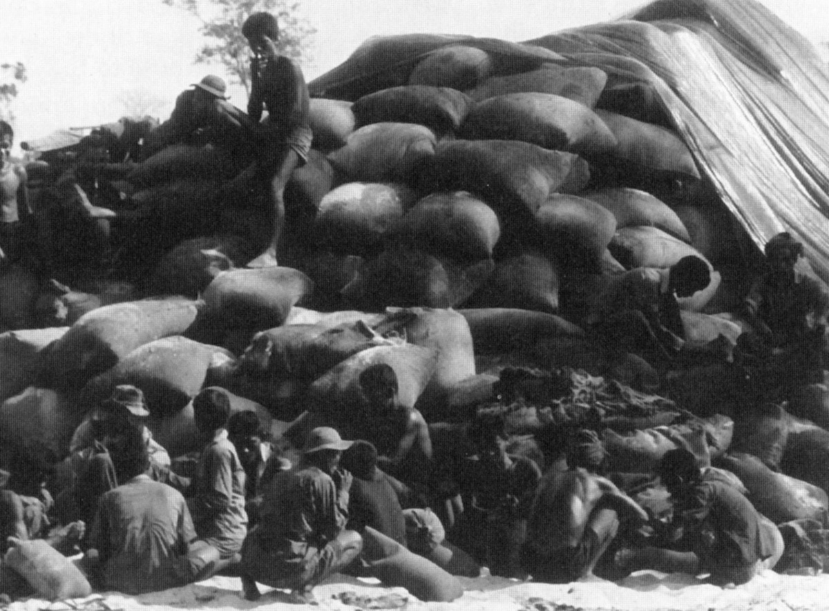 cambodian_civilians_bag_up_captured_nv_rice.jpg