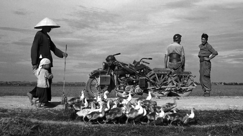 robert_capa_motorbikes_w_peasants.jpg