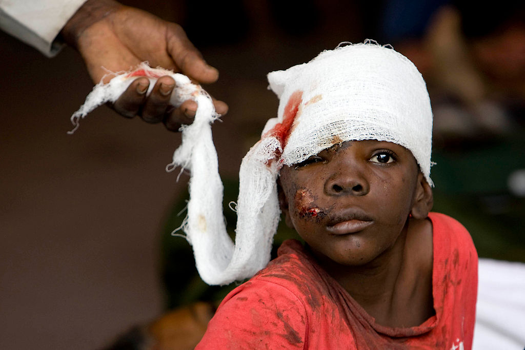 1024px-boy_receiving_treatment_after_haiti_earthquake.jpg