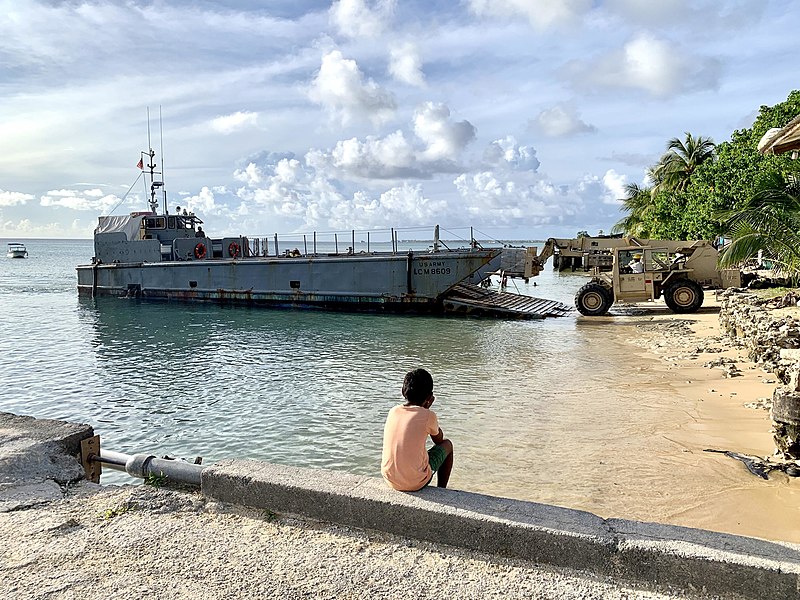 800px-a_marshall_islander_watches_seabees_offload_materials_and_tools_on_kwajalein_atoll_in_the_republic_of_the_marshall_islands_49059732531.jpg