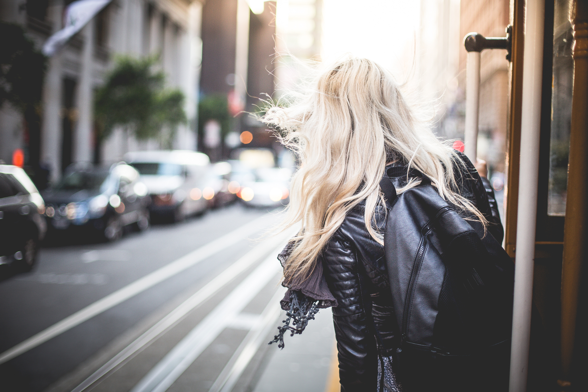 young-woman-riding-the-famous-cable-car-in-san-francisco-picjumbo-com.jpg