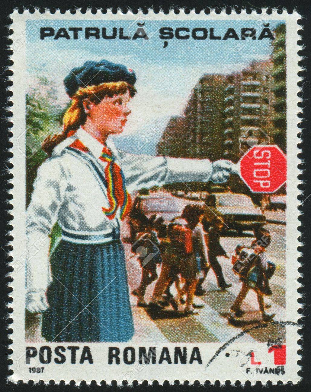 7257688-romania-circa-1987-stamp-printed-by-romania-show-young-pioneer-girl-as-crossing-guard-circa-1987-.jpg