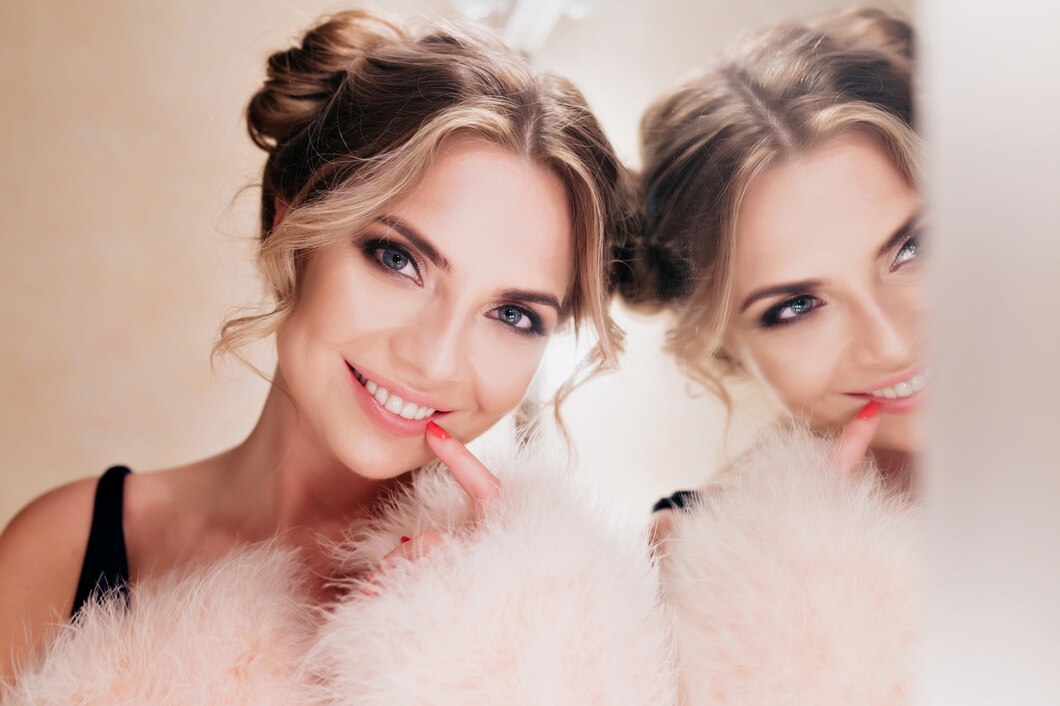 cheerful-laughing-girl-with-cute-hairstyle-posing-while-doing-make-up-mirror-portrait-joyful-curly-young-woman-trendy-coat-standing-with-sincere-smile-light-background_197531-3599.jpg